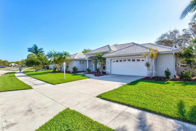 grey home in cape coral fl with grass freshly cut